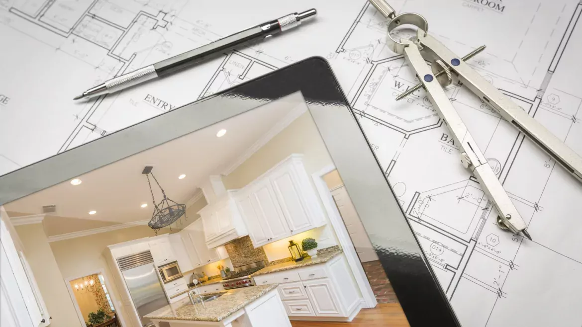 blueprint plans and iPad showing design for a kitchen remodel
